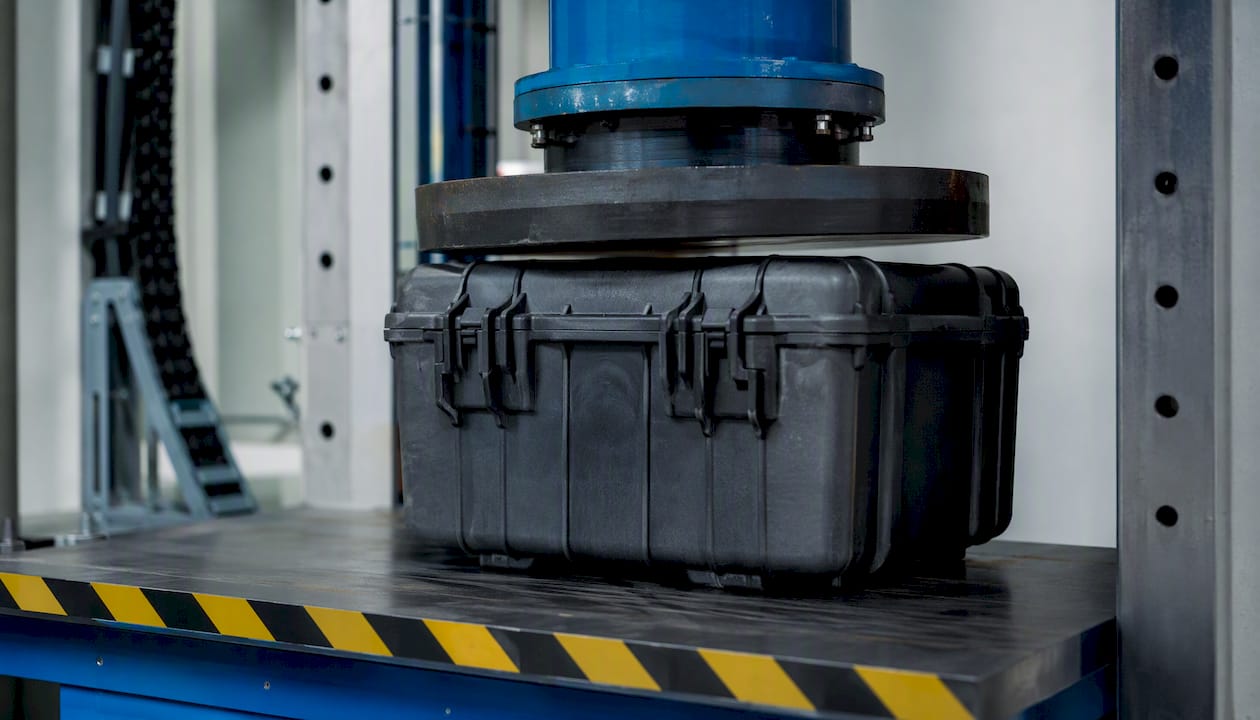 Lab equipment compressing radioactive test package